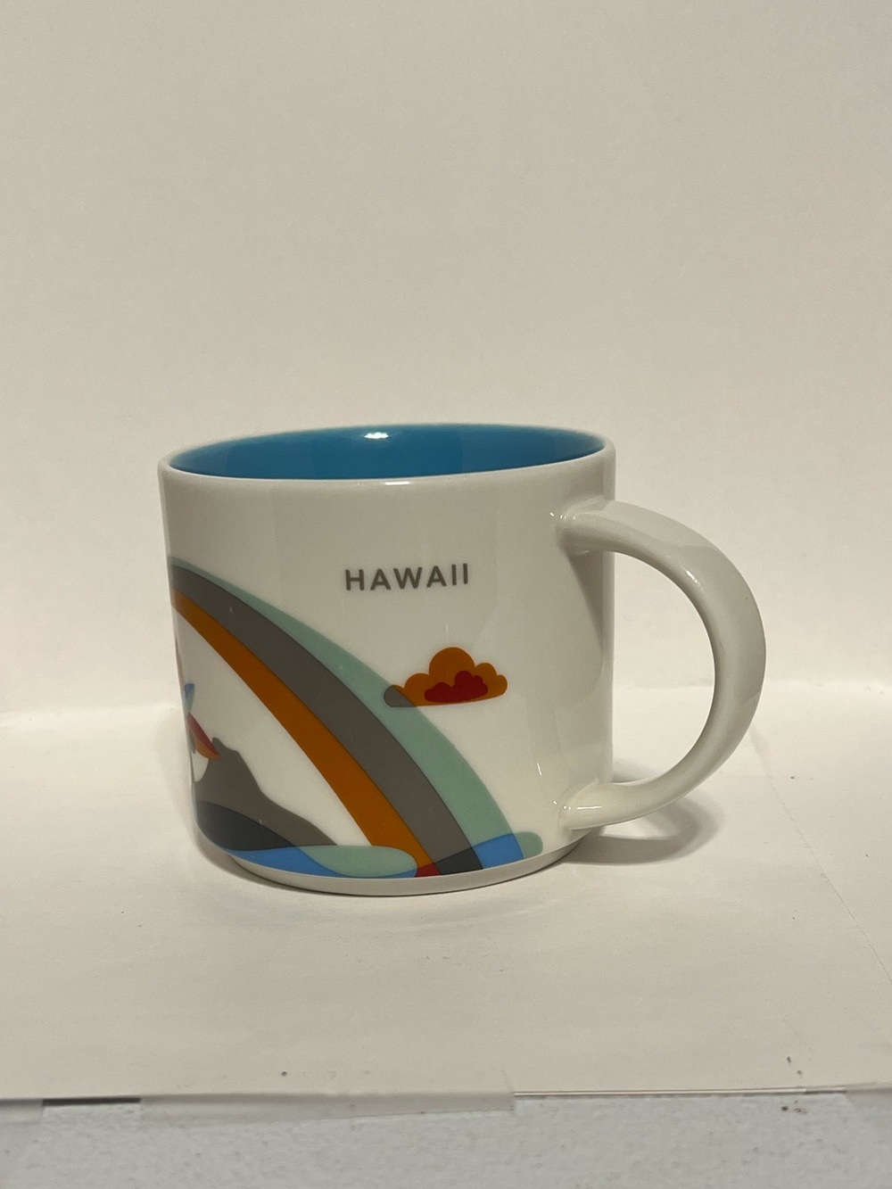 Starbucks White Mug with Blue Interior and Multicolor Rainbow Hawaii Design